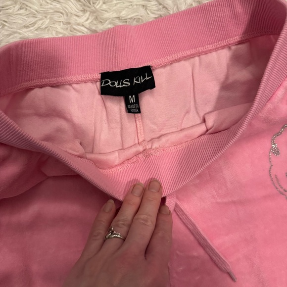 Dolls Kill Pink Velour Sweatpants with Silver Rhinestone Smiley Face - Picture 9 of 12